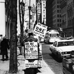 "1976: Harry Britton walking New York's Fifth Avenue campaigning for husbands' rights using sandwich boards."